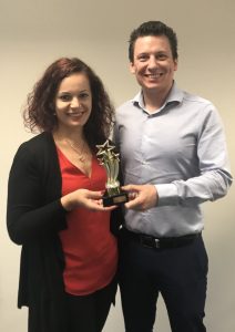 Ana presenting Nathan with the Team Member of the Month Trophy